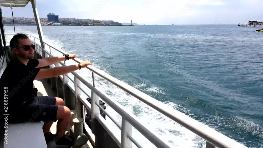 Travelling Man pointing at a destination on ferry (Istanbul, Turkey) Travelling Man pointing at a destination on ferry (Istanbul, Turkey)