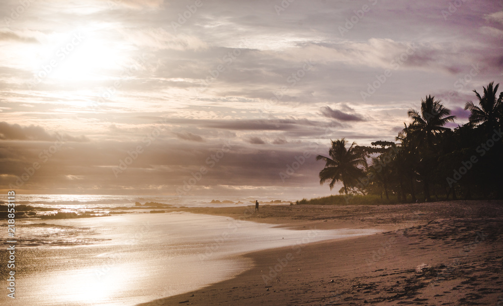 Cloudy peaceful sunset on the long beach of Playa Carmen in Santa Teresa, Costa Rica