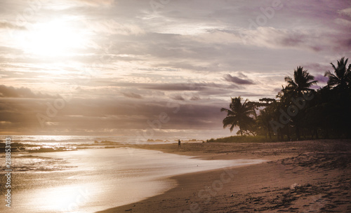 Cloudy peaceful sunset on the long beach of Playa Carmen in Santa Teresa, Costa Rica © Lozzy