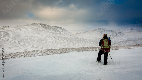 Fotografija A hillwaker in the snow above Glenshee Scotland