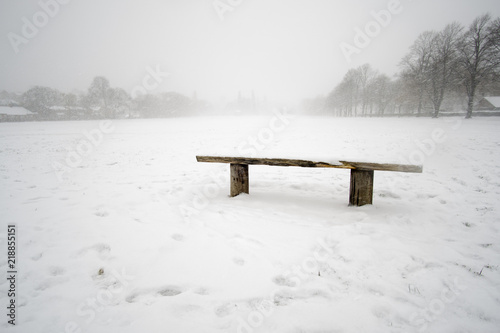 Bench in Snowy Park