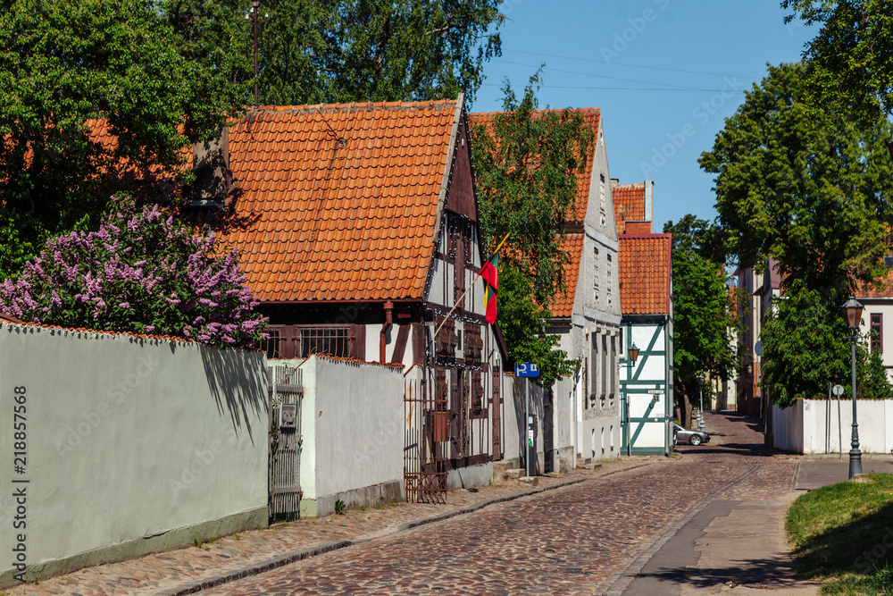 Narrow street of the Old Town district of Klaipeda city, Lithuania.
