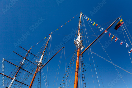 Sailboat mast against a blue Summer Sky