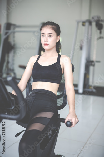 Fitness woman health exercise at gym. Healthy workout concepts.