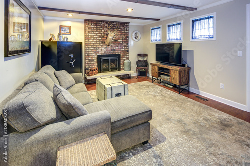 Fotografie Basement living room space with fireplace