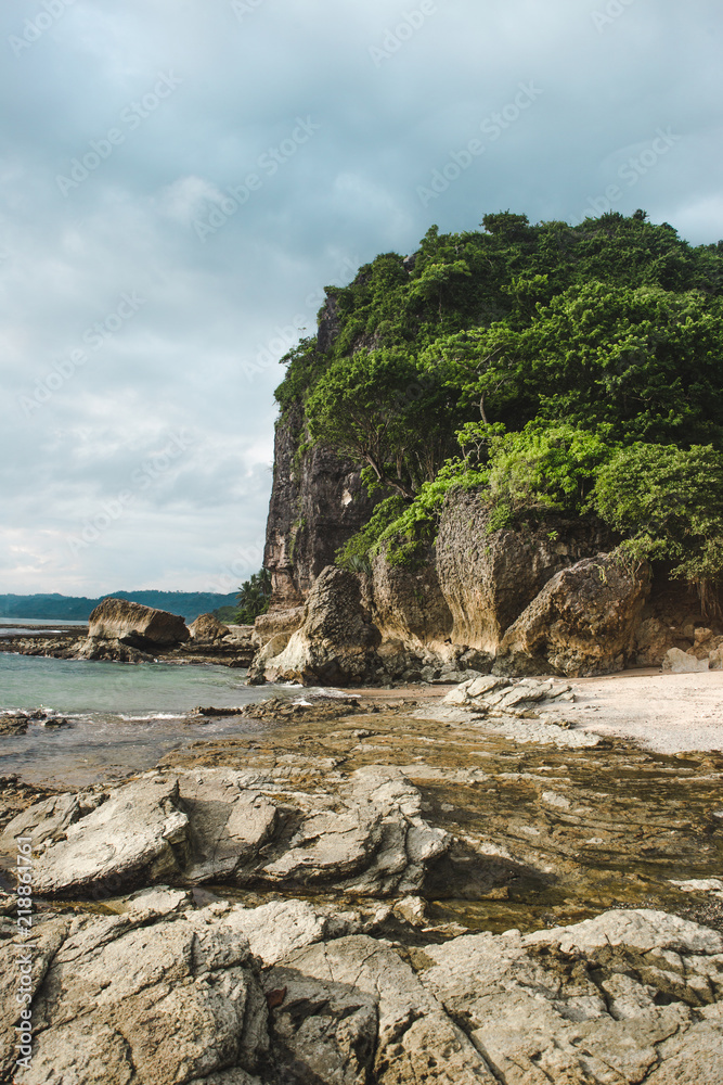 The rocky beach shore of Playa Cuevas in between Santa Teresa and Malpaís on the Nicoya peninsula of Costa Rica The rocky beach shore of Playa Cuevas in between Santa Teresa and Malpaís on the Nicoya peninsula of Costa Rica