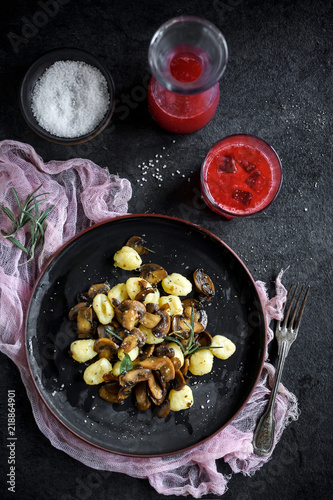 Prepared mushrooms and gnocchi dish served on the table,selective focus
