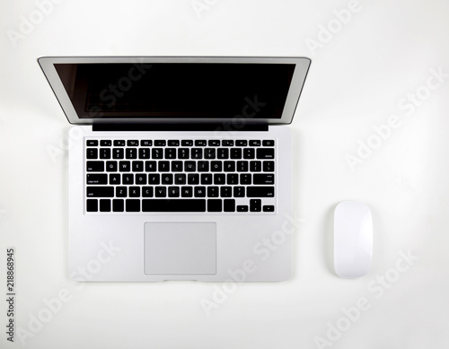 Top view of laptop computer with open display screen monitor and mouse isolated on white background, notebook or netbook with keyboard, communication technology concept.