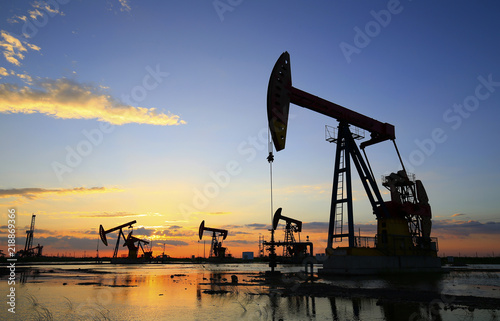 The pumping unit is working in the setting sun