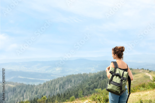 Woman with backpack in wilderness on cloudy day © New Africa