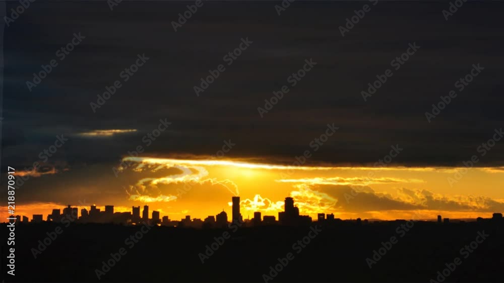 Cinemagraph urban sunset with moving clouds over city Cinemagraph urban sunset with moving clouds over city