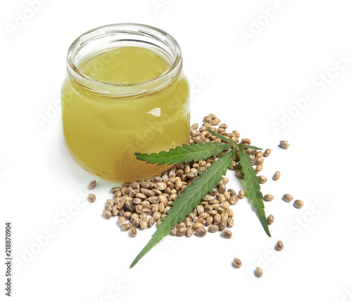 Jar with hemp lotion on white background