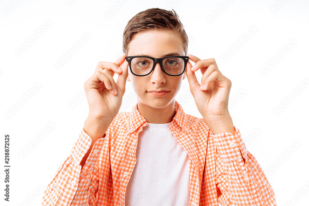 Closeup portrait of teenage boy with glasses, smiling face, in Studio on white background, isolated Closeup portrait of teenage boy with glasses, smiling face, in Studio on white background, isolated