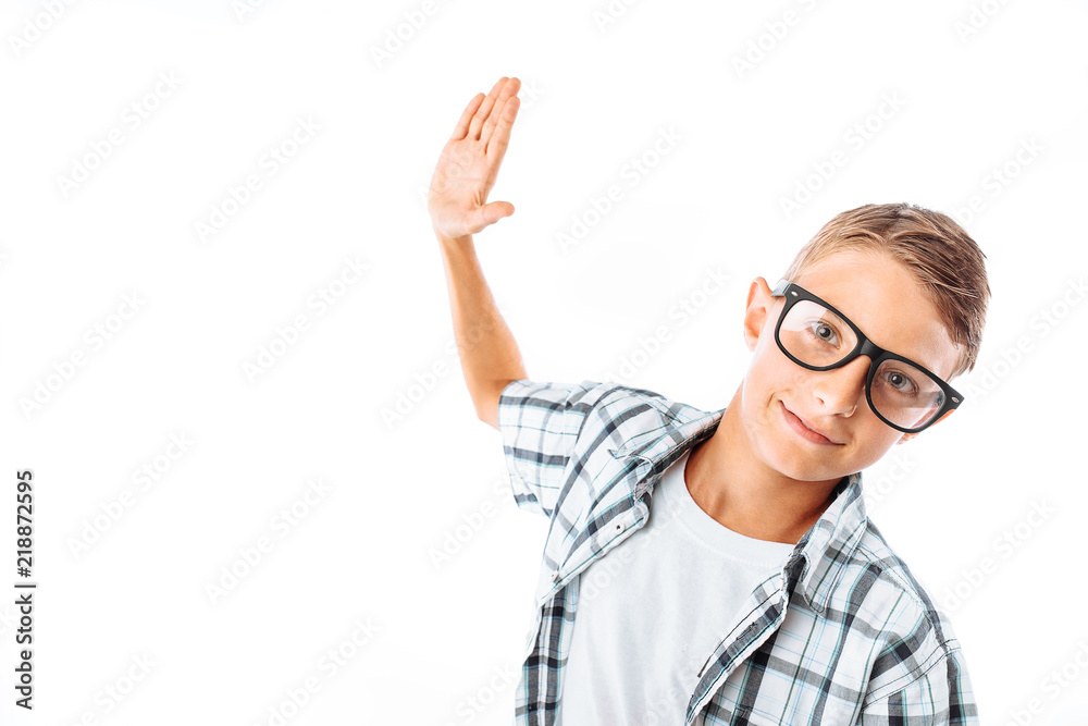 Young handsome man in glasses swinging his hand to give five, nerd in Studio on white background Young handsome man in glasses swinging his hand to give five, nerd in Studio on white background