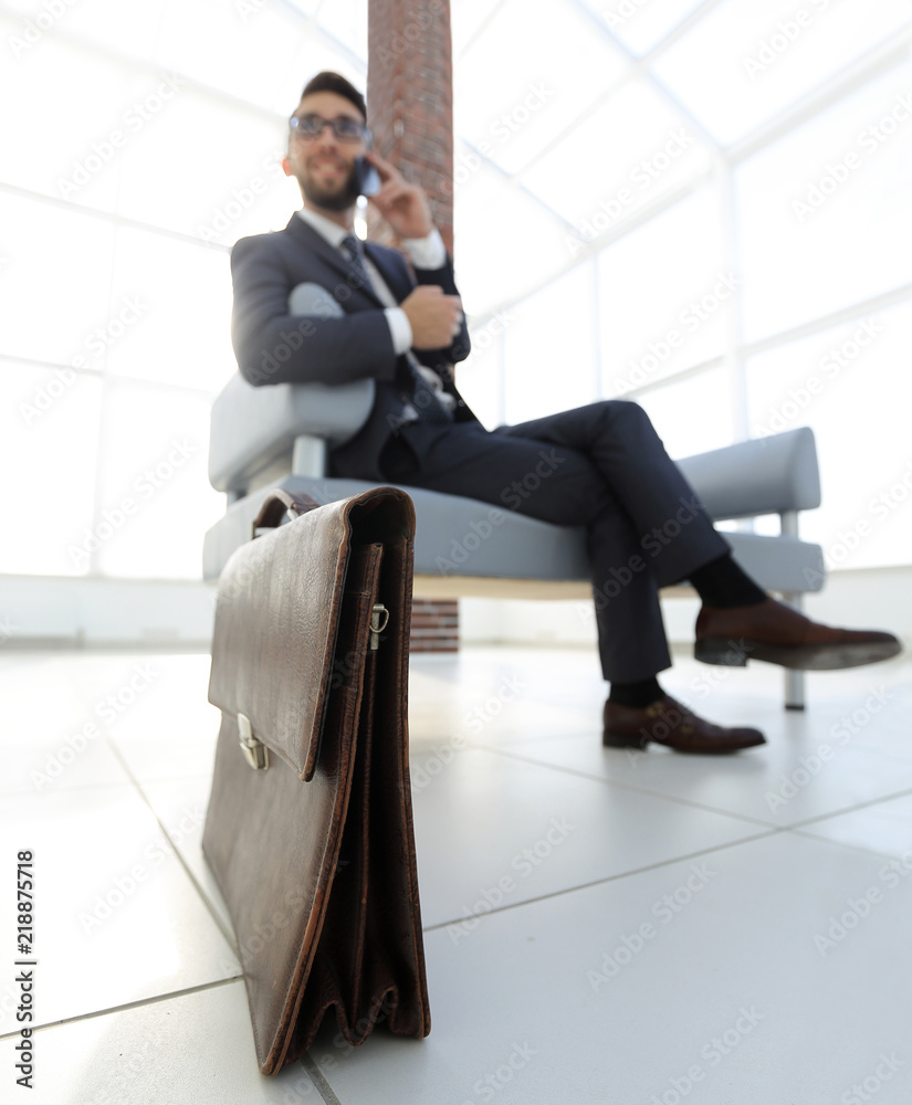 Fototapeta premium businessman holding his briefcase in office