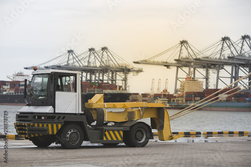 trailer in port with Cargo ship background 