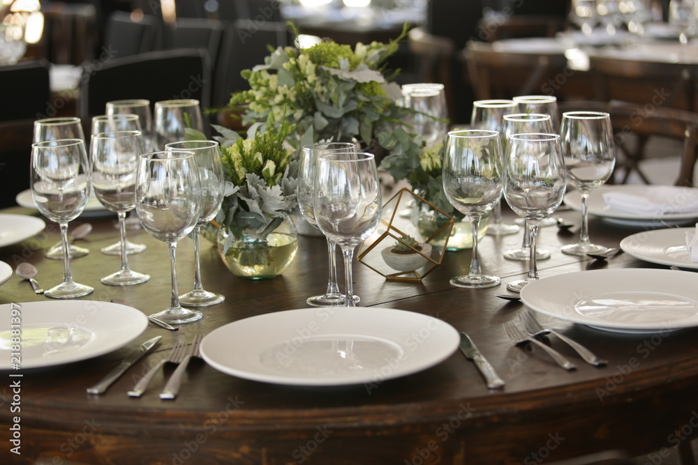 elegant Table decoration with wine glasses, glasses, forks, ornaments, ready to serve in event, wedding, celebration, xv years, baptism elegant Table decoration with wine glasses, glasses, forks, ornaments, ready to serve in event, wedding, celebration, xv years, baptism