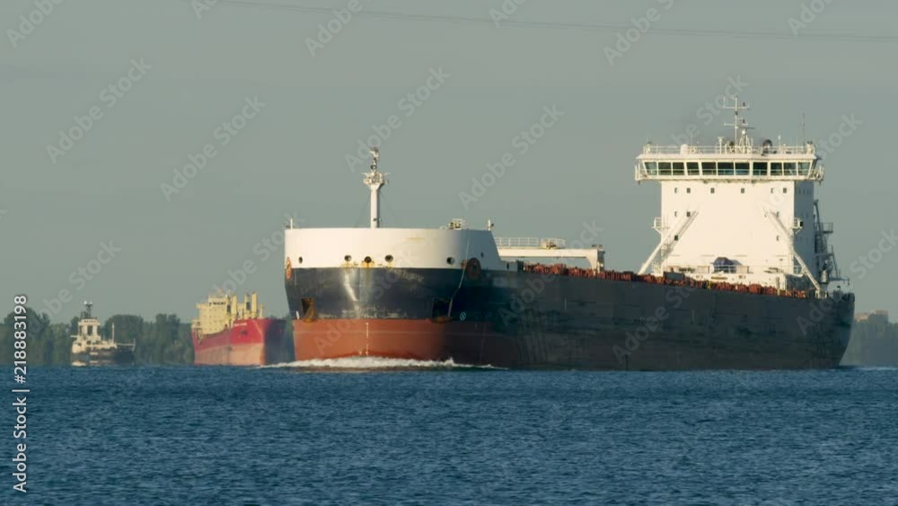 Three Freighters Sailing Waterway Crossing Three Freighters Sailing Waterway Crossing