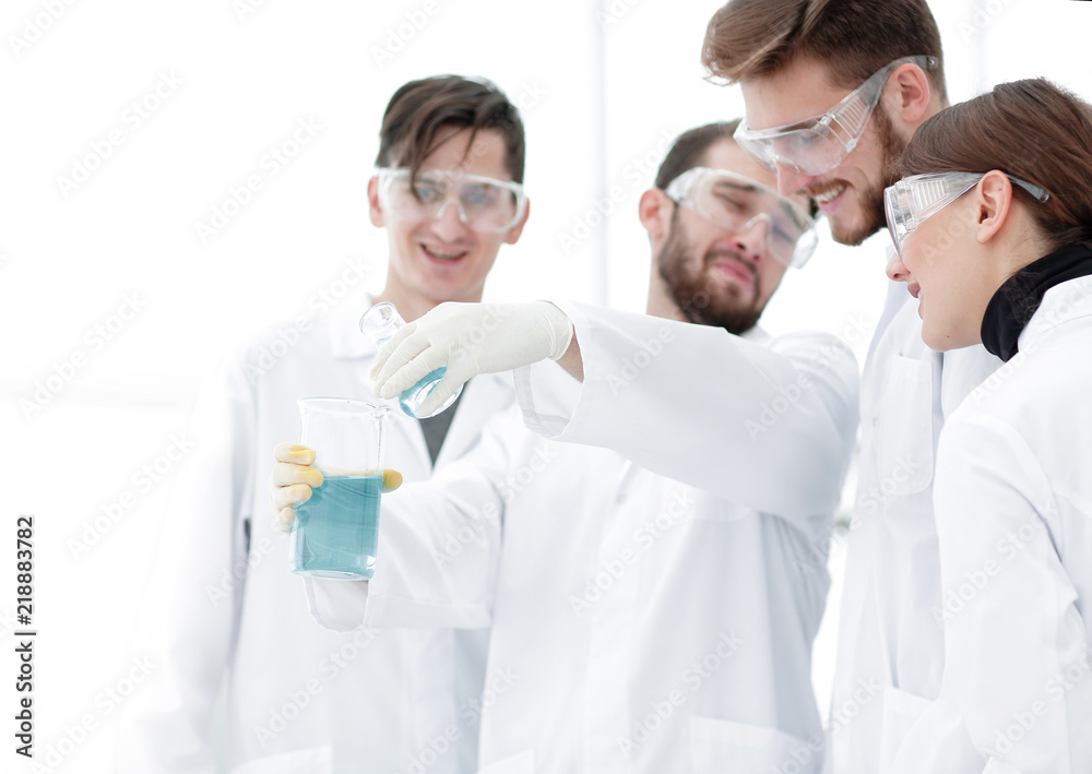 group of scientists working with chemicals group of scientists working with chemicals