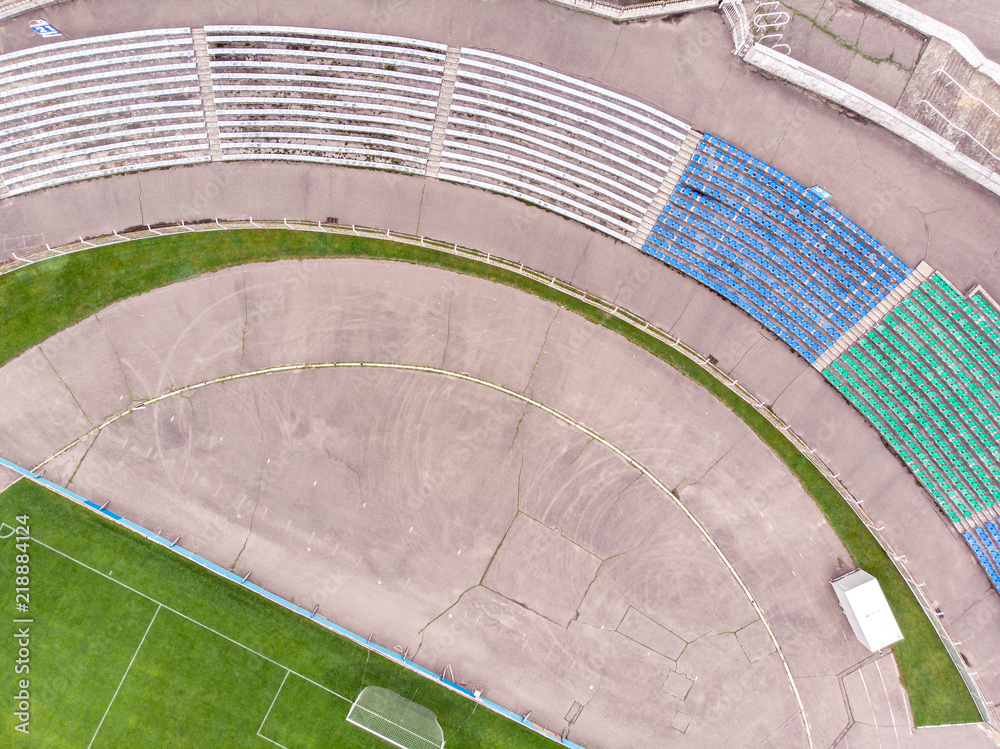 aerial top view of old city stadium with football field. drone photography