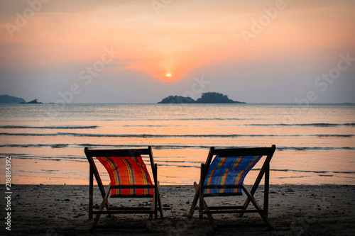 Sun loungers on the sea beach at evening.