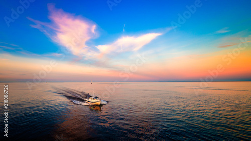 Beautiful sunset at lake superior with sail boats