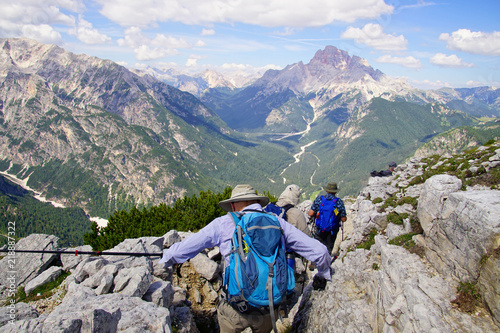 Hikers on steep trail up Monte piana photo