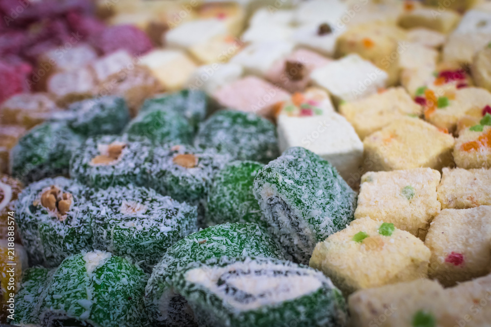 Fototapeta premium Multi-colored rolls oriental sweetness close-up, soft selective focus with shallow depth of field
