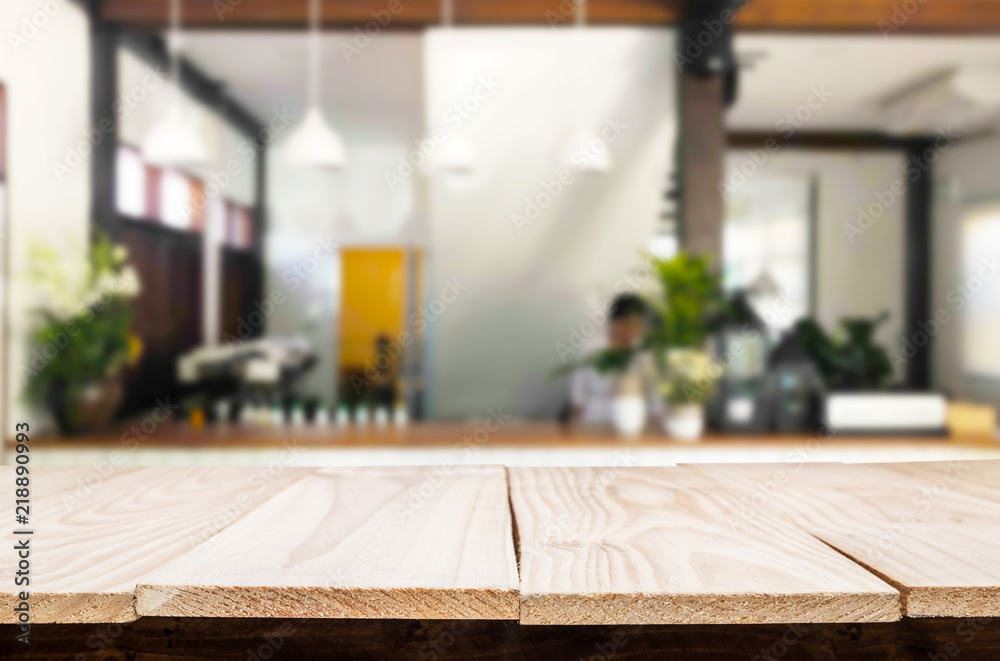 Selected focus empty brown wooden table and Coffee shop or restaurant blur background with bokeh image. for your photomontage or product display Selected focus empty brown wooden table and Coffee shop or restaurant blur background with bokeh image. for your photomontage or product display