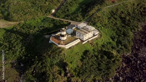 Aerial video of Fugueijiao Lighthouse,  Shimen District, New Taipei, Taiwan. photo