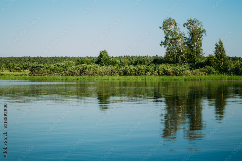 Clear lake with reflection in water Clear lake with reflection in water
