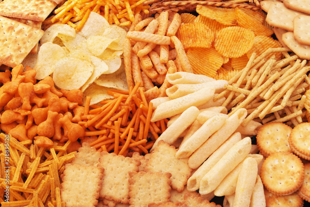 Fototapeta premium Snack food close up, crackers, chips, sticks