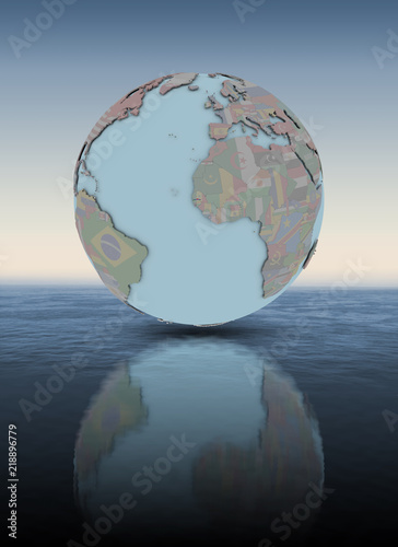Gambia on globe above water surface