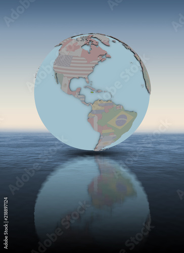 Jamaica on globe above water surface