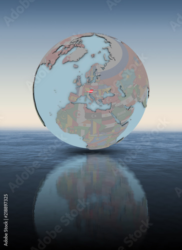 Fototapeta Naklejka Na Ścianę i Meble -  Austria on globe above water surface