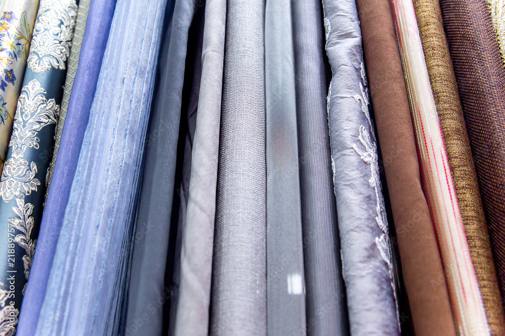 Rolls of fabric and textiles in a shop or store Rolls of fabric and textiles in a shop or store