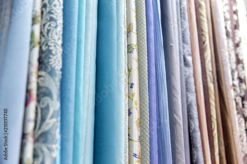 Rolls of fabric and textiles in a shop or store © Nichizhenova Elena