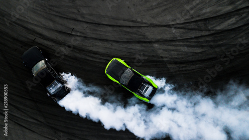Aerial top view two cars drifting battle on race track, Two cars battle drift, Race cars view from above.