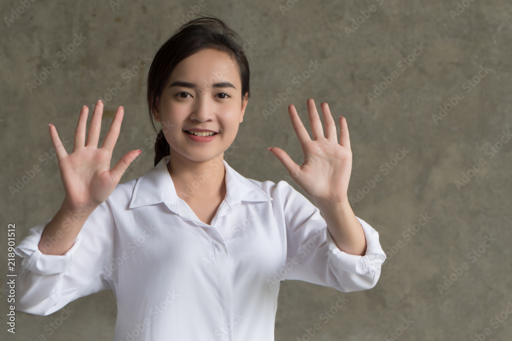asian business woman pointing ten fingers; portrait of positive happy smiling asian businesswoman pointing up ten fingers, 10 points number list; asian chinese 20s young adult woman model asian business woman pointing ten fingers; portrait of positive happy smiling asian businesswoman pointing up ten fingers, 10 points number list; asian chinese 20s young adult woman model