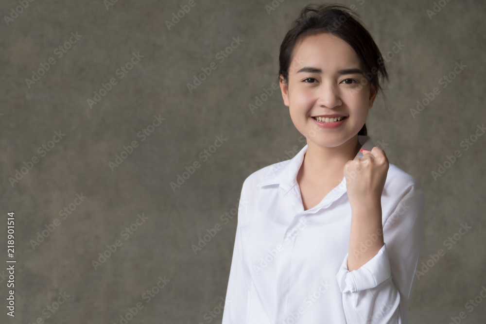 strong winning asian woman in shirt; portrait of strong successful positive excited happy smiling asian business woman, smart casual style, success concept; asian chinese thai young adult woman model strong winning asian woman in shirt; portrait of strong successful positive excited happy smiling asian business woman, smart casual style, success concept; asian chinese thai young adult woman model