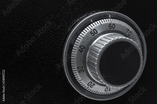 Close-up of a combination dial on a safe.