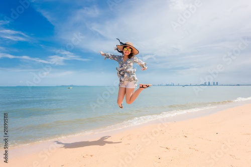 The woman is happy and jumps on her holiday.