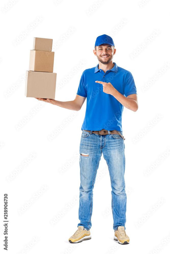 Full length portrait of delivery man shows on boxes in his hand Full length portrait of delivery man shows on boxes in his hand