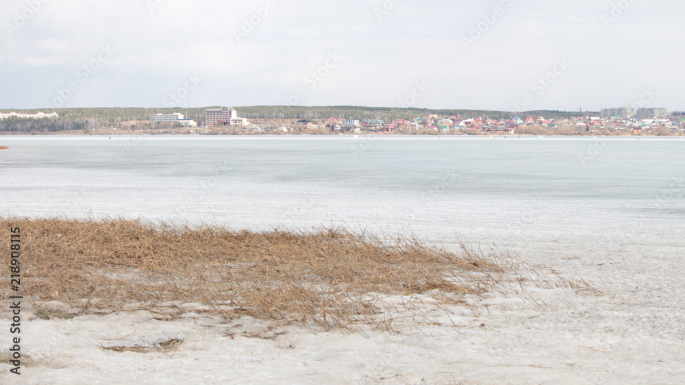 the city on the background of frozen river