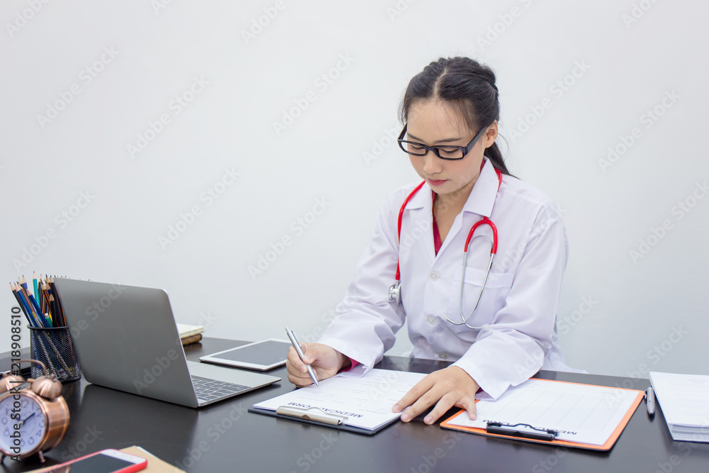 Young doctor woman working on laptop and diagnose a patient illness. Young doctor woman working on laptop and diagnose a patient illness.