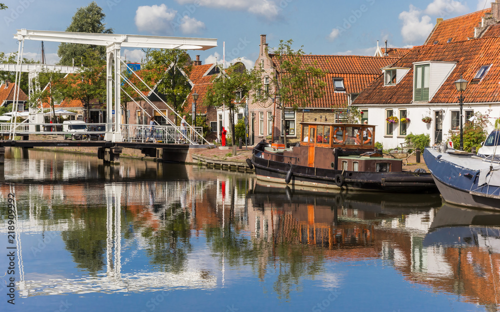 White bridge with reflection in he canal in Edam, Netherlands