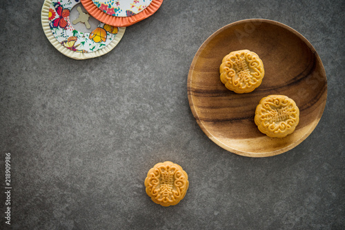 Mid-Autumn Festival Moon cakes with copy space on low light background