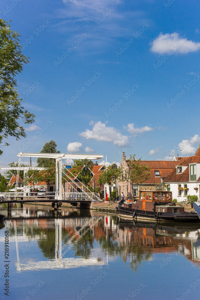 White bridge with reflection in he canal in Edam, Netherlands