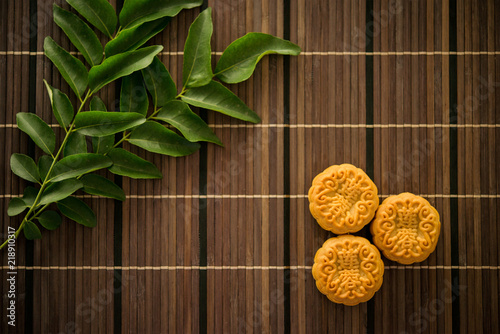 Top down moon cakes on bamboo mat