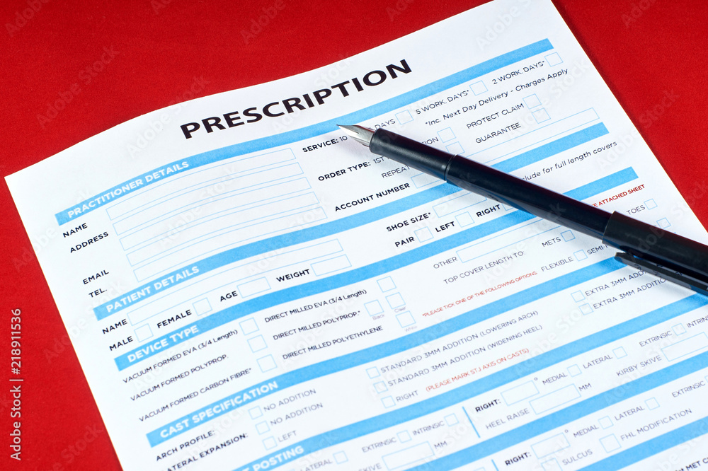 Fototapeta premium prescription and pen on red velvet background